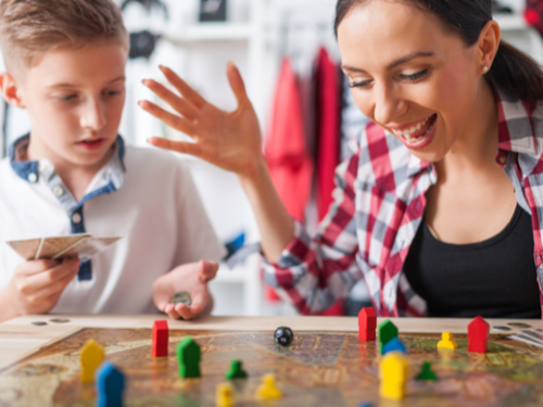 MOther playing a board game with a child