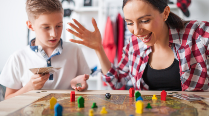 MOther playing a board game with a child